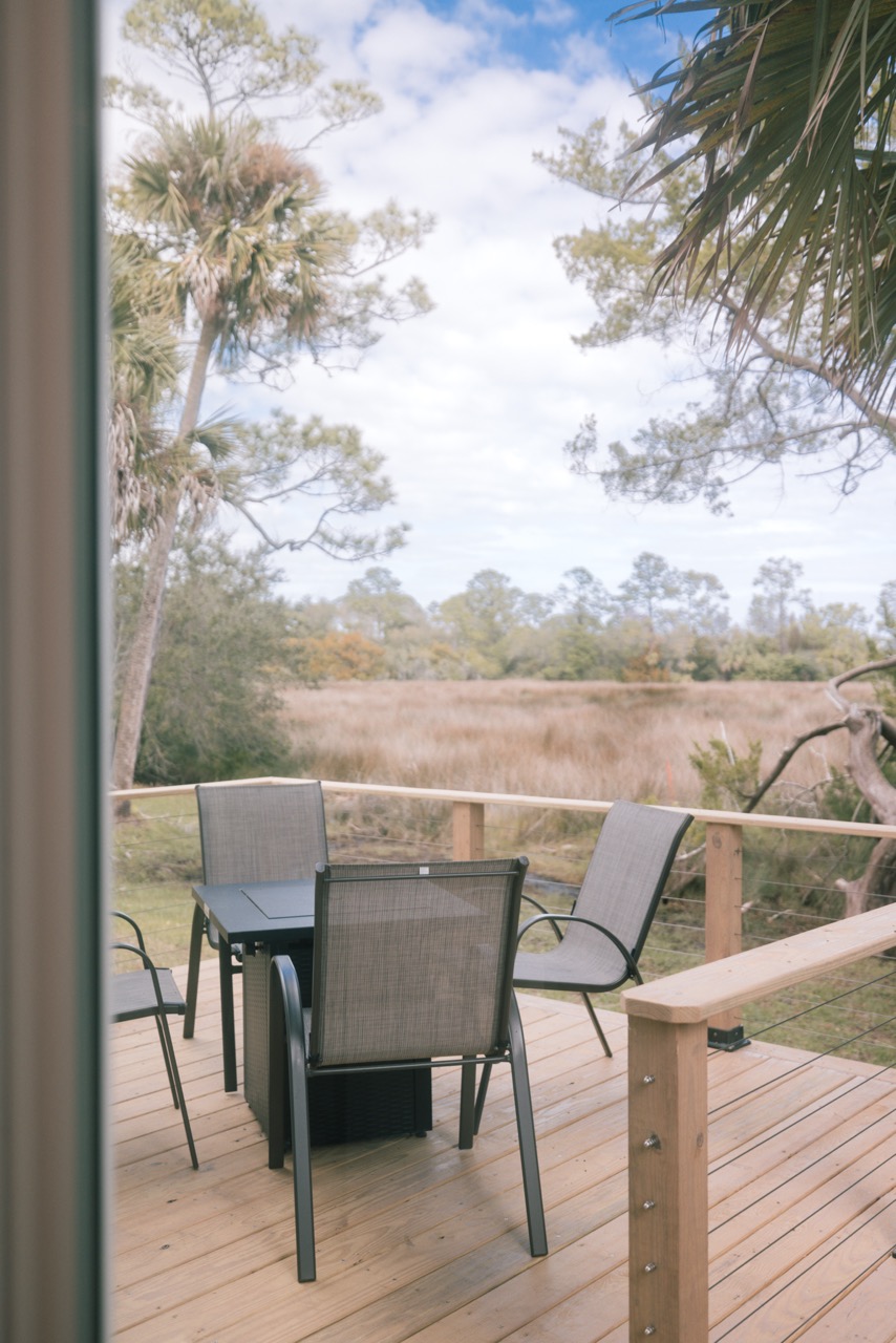 Deck and fire pit facing the marsh